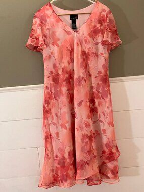 A pink retro-style dress with floral patterns